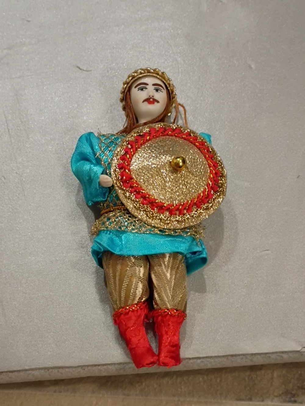 Rushion Handcrafted Doll Christmas Ornamentwith Turquoise Outfit and Gold Shield